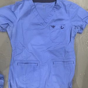 Small ceil blue scrub top, one tiny bleach spot on front, gently worn
